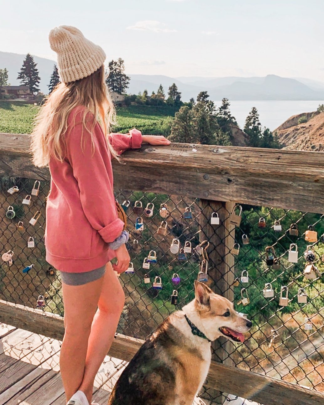 Women with her dog standing on McCulloch Trestle overlooking the Naramata Bench