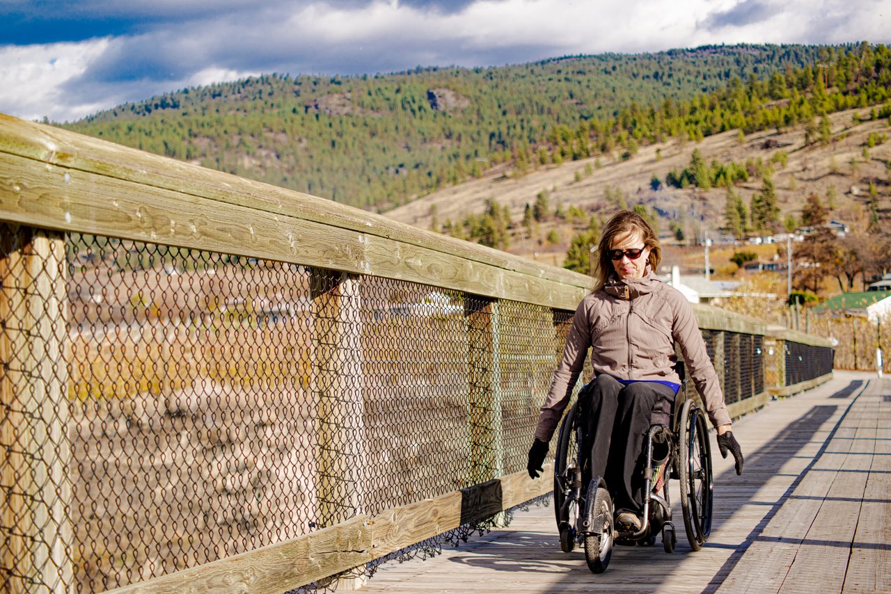 Accessible Tourism - touring the kettle valley rail trail on the mcullouch trestle in a wheelchair