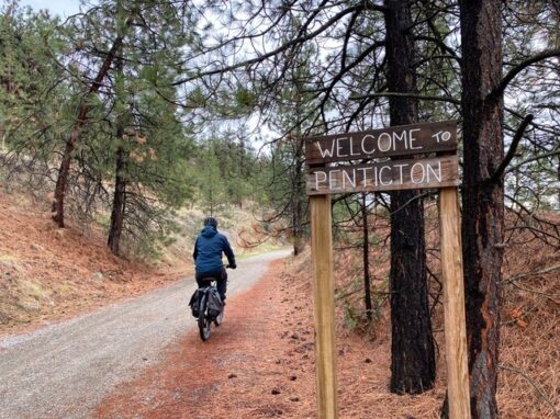 welcome to penticton sign as you bike along the kvr trail from naramata back into penticton
