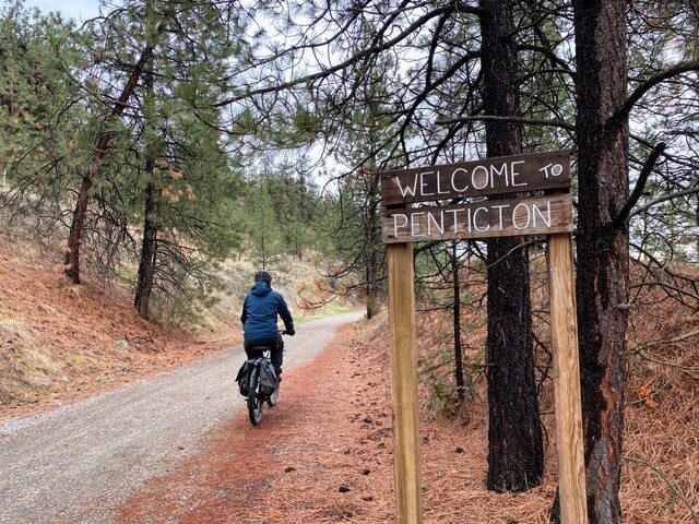 welcome to penticton sign as you bike along the kvr trail from naramata back into penticton