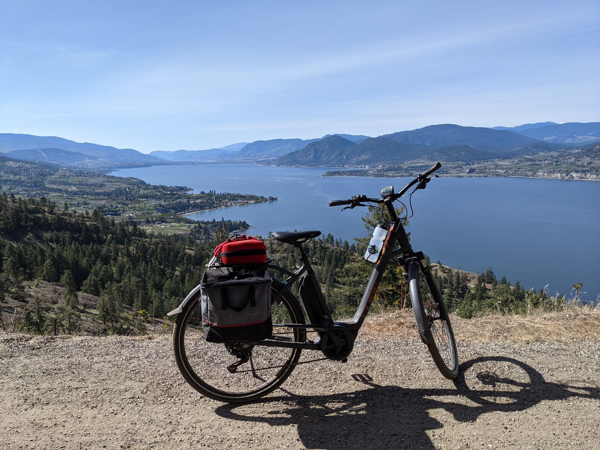 e-bike looking down at anaramata and penticton near little tunnel on the kvr trail