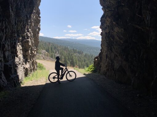 sitting on a bik inside the little tunnel above narmata on the kvr trail