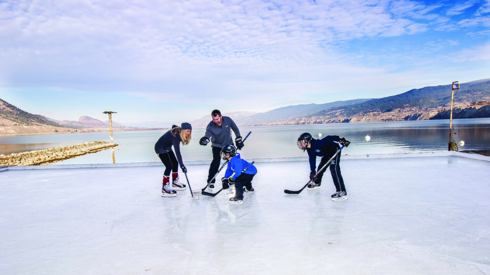 family skating at the penticton lakeside resort lakefront rink