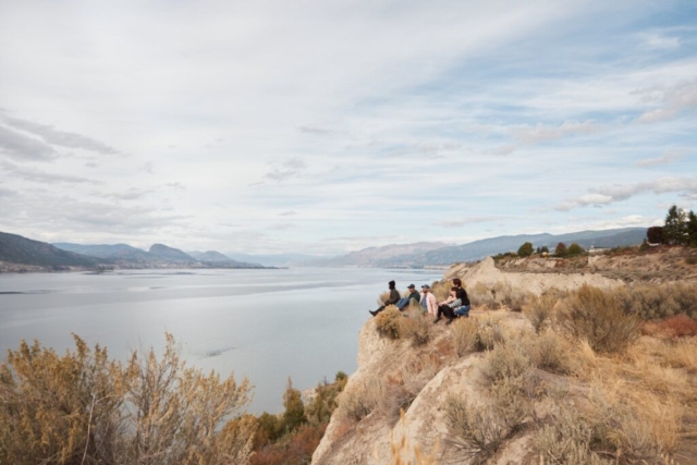 KVR Trail in fall, group of people by trail overlooking Okanagan Lake