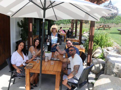 Bubbles Don't Guests enjoying vineyard side patio tasting at Four Shadows Winery.
